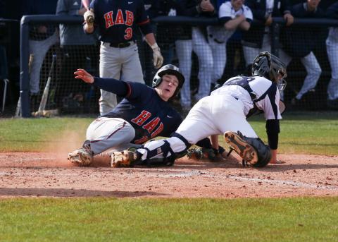 Habersham Central’s Christian King (10) slides into home plate during the Raiders’ 6-3 win over White County High School Saturday in Cleveland.