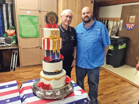 At Tuesday’s American Legion 100th year celebration, the oldest and youngest veterans present took a moment for a picture with the cake. Van Wunderlich, 94, of Demorest served in World War II, while Corp. Michael Dale, 39, of Cornelia served in Afghanistan.