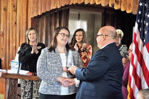 North Georgia Tech College President Dr. Mark Ivester hands the GOAL award to Dietra Gray. 