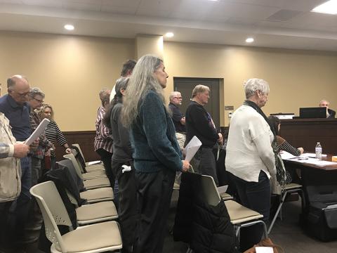 Residents of the Echota/Stonebank Road neighborhood stood in support as their petition to deny a local wedding venue from opening there was read Monday night at the Habersham County Board of Commissioners meeting.