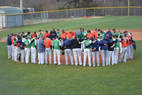 Members of the Habersham Central and Franklin County high school baseball teams pray for Raider Hadden Carswell before their game Friday. Carswell was seriously injured in an automobile accident Feb. 24.