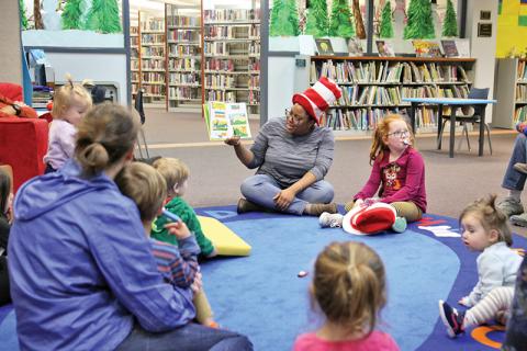 Clarkesville Library hosted a Dr. Suess celebration as the world famous children’s author’s birthday was March 2. Children gathered for arts and crafts activities and reading Thursday. Youth Services Specialist Ashawna Green, children and parents gather for story time.
