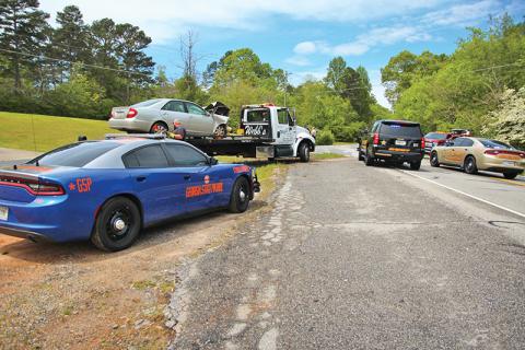 A two-car crash Sunday put four people in the hospital after an alleged failure to yield at a stop sign. 