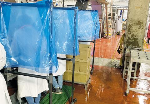 Separation stands have been placed between workers at the Fieldale Cornelia processing plant.
