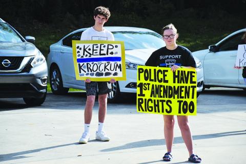 Tucker Demore and Saylor Krockum were among many in the Demorest City Hall parking lot Tuesday hoping to hear from the City Council. 