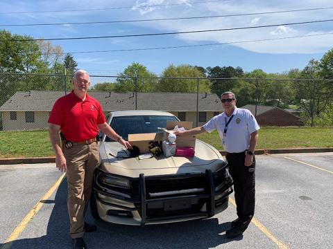 Emergency Services Director Chad Black (right) helped supply Sheriff Joey Terrell’s Office with 295 N-95 masks from the Department of Public Health.