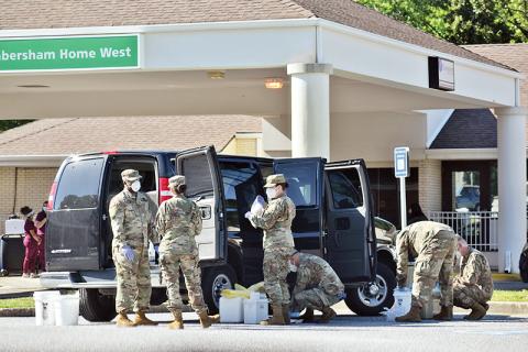 Members of the National Guard load a van up with supplies on Saturday, May 2, after conducting onsite coronavirus testing for all of the residents and staff members at Habersham Home, Habersham Medical Center’s nursing home. Photo by CODY ROGERS/Staff