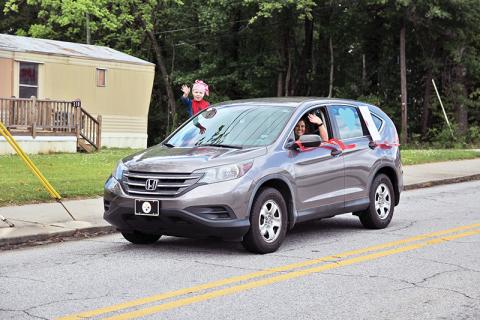 Cornelia Elementary School teachers along with Habersham County public safety personnel drove through the streets of Cornelia to wish them a happy and safe summer on Thursday.  Principal Amy McCurdy said more than 50 vehicles were estimated to have participated. Photos by ERIC PEREIRA/Staff