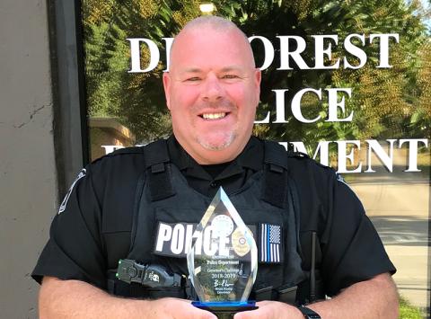 Former Demorest Police Chief Robin Krockum shows off the department’s award for best highway safety in the state in 2018-19.