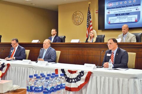 Candidates for State Senate District 50 listen to each other’s comments Tuesday night. Bottom row from left are Andy Garrison, Dan Gasaway and Stacy Hall, and top row from left are Bo Hatchett, Tricia Hise and Lee Moore.