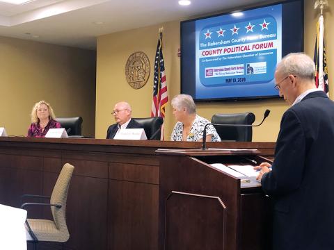 Candidates for probate judge (from left) Cindy Freeman, John Whitfield and Pam Wooley discuss the issues Tuesday night with moderator Joel Williams of WCON Radio. Photo courtesy of Farm Bureau