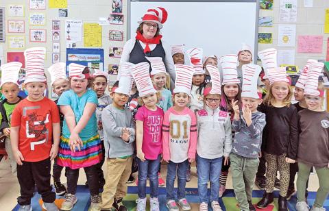 Deana Snowden celebrates the legacy of Dr. Seuss with her Demorest Elementary pre-K students earlier this school year.
