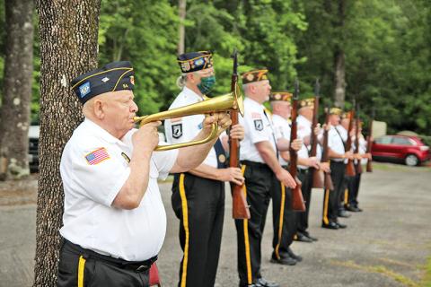 Woodrow Free plays Taps following the three-round valley at the Memorial Day ceremony. 