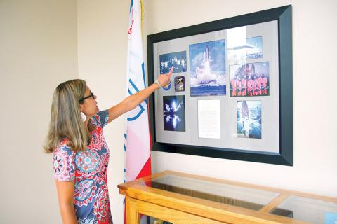 Tallulah Falls School Upper School Academic Dean Kim Popham observes the many keepsakes reminiscing when students and faculty won the opportunity to travel to the White House.