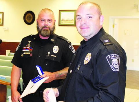 Baldwin Interim Chief Matthew Nall (right) recognized Lt. Ryan Provost at Monday’s Baldwin City Council meeting.