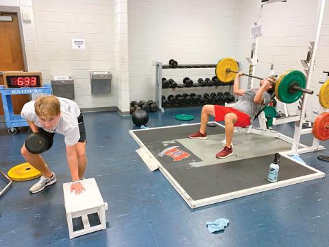 Habersham Central’s Grant Tipton (left) and Gabe Hudlow run through weight training and drills earlier this week after returning to campus for the first time since the COVID-19 shutdown.