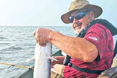 Richard Nichols is shown with a big catch from the weekend's fishing trip that ended abruptly.