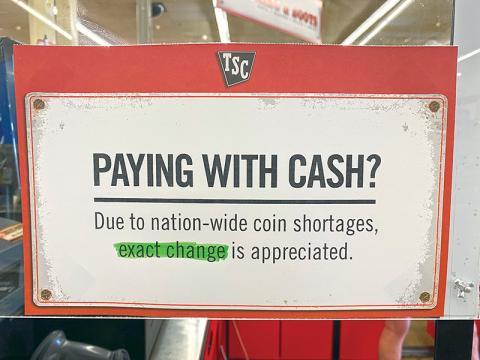 A sign at Tractor Supply in Cornelia lets folks know they are short on change.