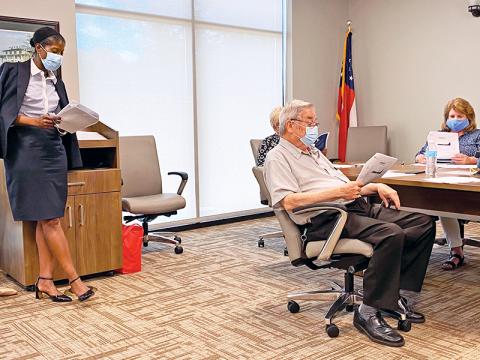 Dr. Pamela Logan (left) provides an update to the Habersham County Board of Health on Friday.