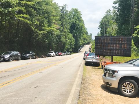 Crowds were heavy at Panther Creek on Fourth of July weekend, including some cars that were towed for being illegally parked.
