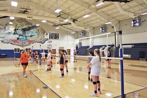 Hopeful Lady Raiders get instructions for a passing drill during the tryouts.