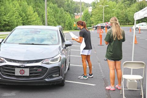 Piedmont College students moving into campus (and people helping them) have to successfully pass a health screening as they did Thursday near the Arrendale Amphitheater.