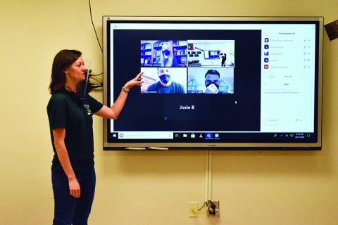 Dallas Barron demostrates Tallulah Falls’ blended learning technology for the 2020-21 school year. The system helps international students participate until they can return to campus later this semester.