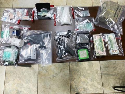Guns and money were seized along with $8,000 worth of meth and heroin in a bust Friday by the Appalachian Regional Drug Enforcement Office.
