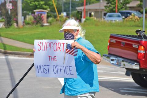 A local woman, who did not want to give her name out of fear of retaliation for her beliefs, wanted everyone in Clarkesville to know how vital the U.S. Postal Service is as she demonstrated for more than an hour on the morning of Aug. 22.