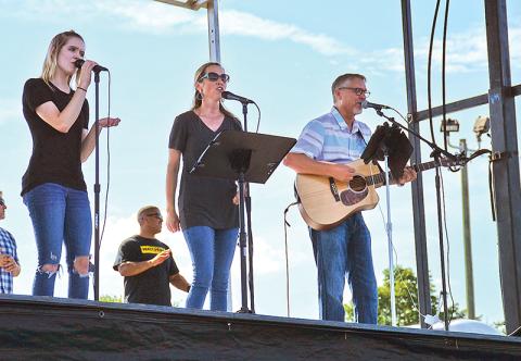 Salem Dover, Alice Dover and Alan Baker perform at Sunday's prayer meeting at Habersham Ninth Grade Academy.