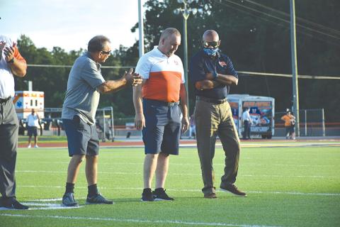 Habersham Central Ring of Honor inductee Jerry Pulliam (left) talks football with fellow defensive legends and inductees Jeff Gerrin and Fernandez West before Friday’s game. LILLIAN VAN TASSEL/Special