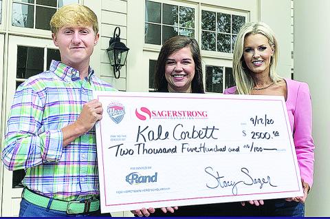 Kale Corbett  receives a check for $2,500 scholarship in addition to being named the 2020 SagerStrong Foundation Hometown Hero. To Corbett’s right are Randi Minor, Principal at Rand Refrigeration and Stacey Sager, President of the SagerStrong Foundation.