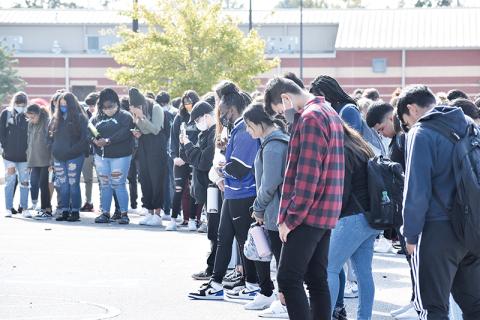 Habersham Central students stand for a moment of silence during a school walkout initiative Tuesday morning.