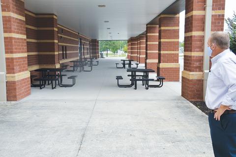 Habersham Central Principal Jonathan Stribling overlooks one of his school’s new outdoor classroom spaces, prompted by the need to social distance when schools reopen Tuesday, Sept. 8.