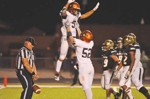 Habersham Central’s Jackson Clouatre gets a lift from Pierce Vickery after scoring one of his three touchdowns against Apalachee on Friday night. Photos by TOM ASKEW