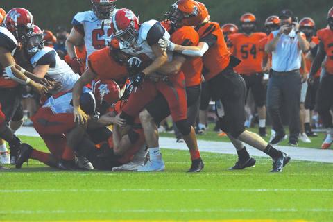 Habersham Central’s defense stacks up a Madison ballcarrier during Friday’s game. The first-team defense shut the Red Raiders out in the 27-6 win. LILLIAN VAN TASSELL/Special