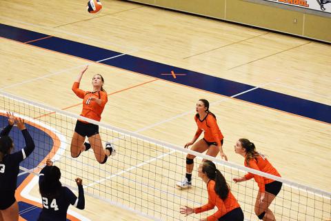 Habersham Central’s Allie Church gets up high going for a spike during a recent match.