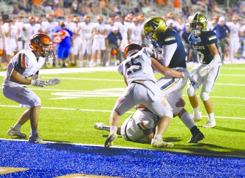 Habersham Central’s Patrick Tedder (15) makes the hit to help the Raiders make a goal line stand against Apalachee last week. TOM ASKEW/Special