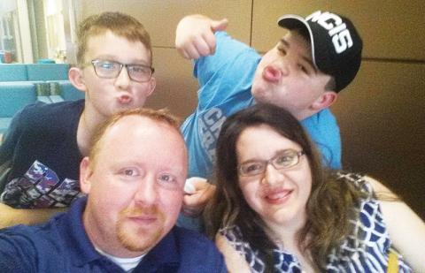 Shawn Weldy (bottom left) used lessons learned young to build a successful career and family, along with wife Laura and sons Tucker and Hayden.