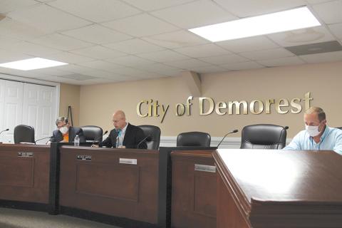 Councilman John Hendrix, Mayor Rick Austin and Councilman Nathan Davis conduct business at the Tuesday night meeting. 