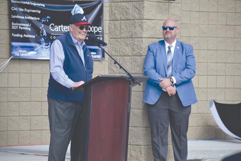 Former Georgia Sen. John Foster (left) smiles after Cornelia dedicated its new water plant to him during a ceremony Monday. Cornelia City Manager Dee Anderson made the introduction. 