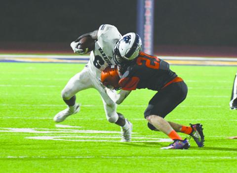Habersham Central’s Austin Wood lays a stick on White County’s Silas Mulligan during last Friday’s game at John Larry Black Field. TOM ASKEW/Special
