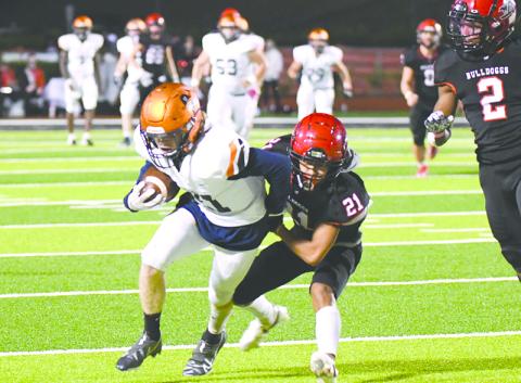 Habersham Central’s Austin Wood looks to break free of Winder-Barrow’s Alex Cha during Friday night’s game. TOM ASKEW/Special