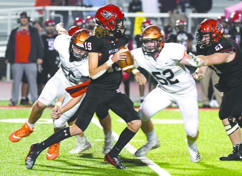 Habersham Central’s Pierce Vickery (52) and Jonathan Adams (55) pressure Winder-Barrow quarterback Trevor Summerfield during Friday night’s win over the Bulldoggs. TOM ASKEW/Special