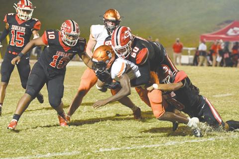 Habersham Central’s Joshua Pickett is brought down after a run by Stephens County’s D.J. Hampton (60) and Bryson Trimier (9) during Friday’s game. TOM ASKEW/Special