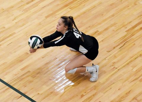 Tallulah Falls’ Rebekah Jennings digs a ball during the Lady Indians’ first playoff game.