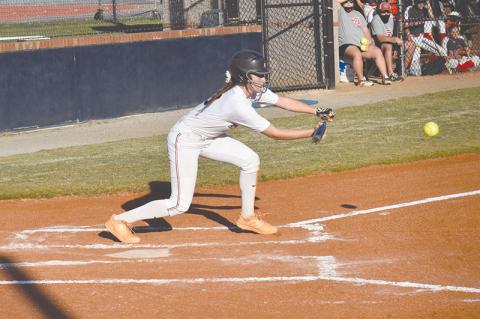 Taylor Wade lays down a bunt for a hit Monday’s win over Winder-Barrow. Wade reached base four times and scored three runs for the Lady Raiders.