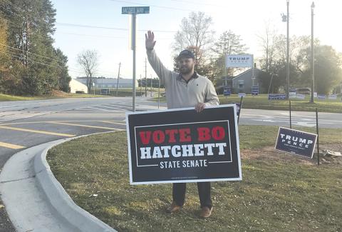 Georgia Senator-elect Bo Hatchett waves to cars Tuesday morning on Louise Street and Jacob’s Way near the Ruby Fulbright Aquatic Center.