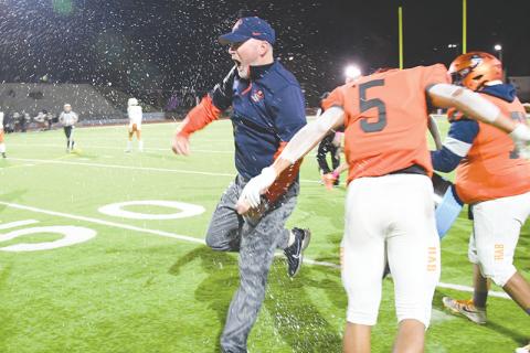 Habersham Central coach Benji Harrison celebrates after having Gatorade poured on him following the Raiders' win over Lanier. TOM ASKEW/Special