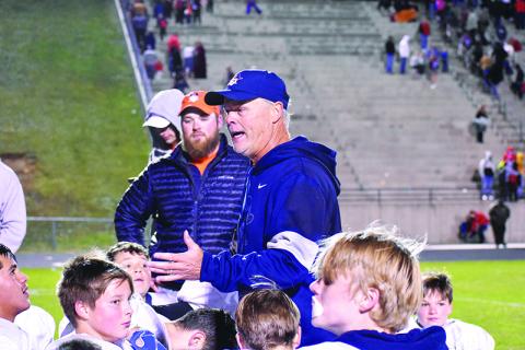 Habersham middle school football coach Mark Ausburn talks with his team after winning the league championship on Nov. 2.